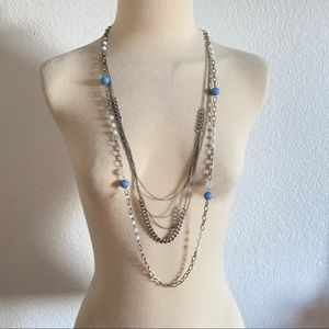 Silver tone long multi layered statement necklace with chains and round beads